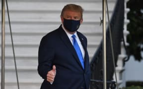 US President Donald Trump walks to Marine One prior to departure from the South Lawn of the White House in Washington, DC, October 2, 2020, as he heads to Walter Reed Military Medical Center, after testing positive for Covid-19.