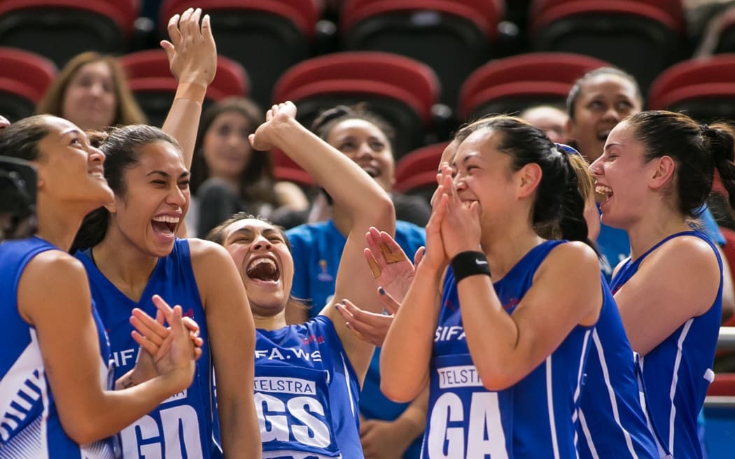 Samoan players share a laugh at the Netball World Cup.
