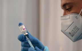 A health worker prepares a dose of the AstraZeneca vaccine against Covid-19.