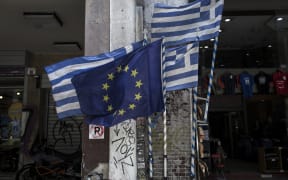 European Union and  Greek flags.