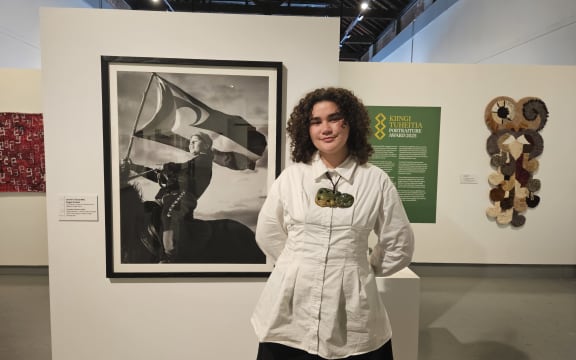 The winner of the 2025 Kiingi Tuheitia Portraiture Award Jazmin Tainui Mihi Paget-Knebel with her winning photo Taniwha Chasers.