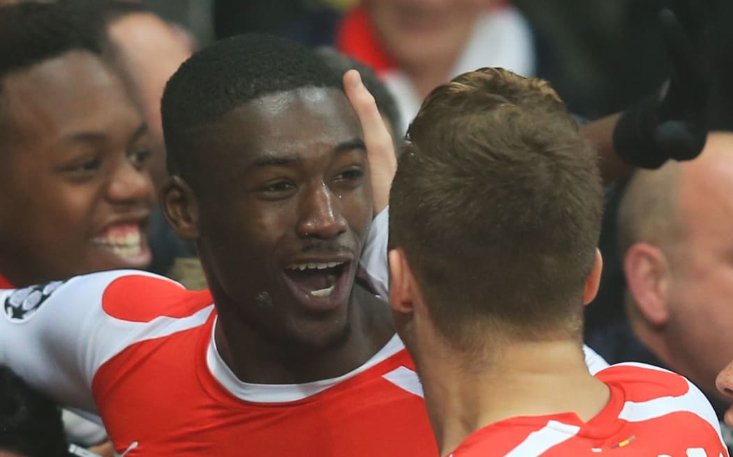 Yaya Sanogo celebrates his goal for Arsenal against Borussia Dortmund