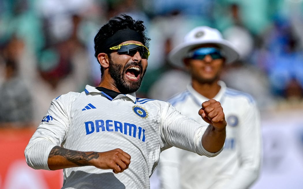 India's Ravindra Jadeja celebrates after taking a wicket.