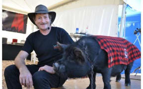 Billy Black Woolman with pig