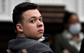 KENOSHA, WISCONSIN - NOVEMBER 12: Kyle Rtttenhouse looks back as attorneys argue about the charges that will be presented to the jury during proceedings at the Kenosha County Courthouse on November 12, 2021 in Kenosha, Wisconsin.