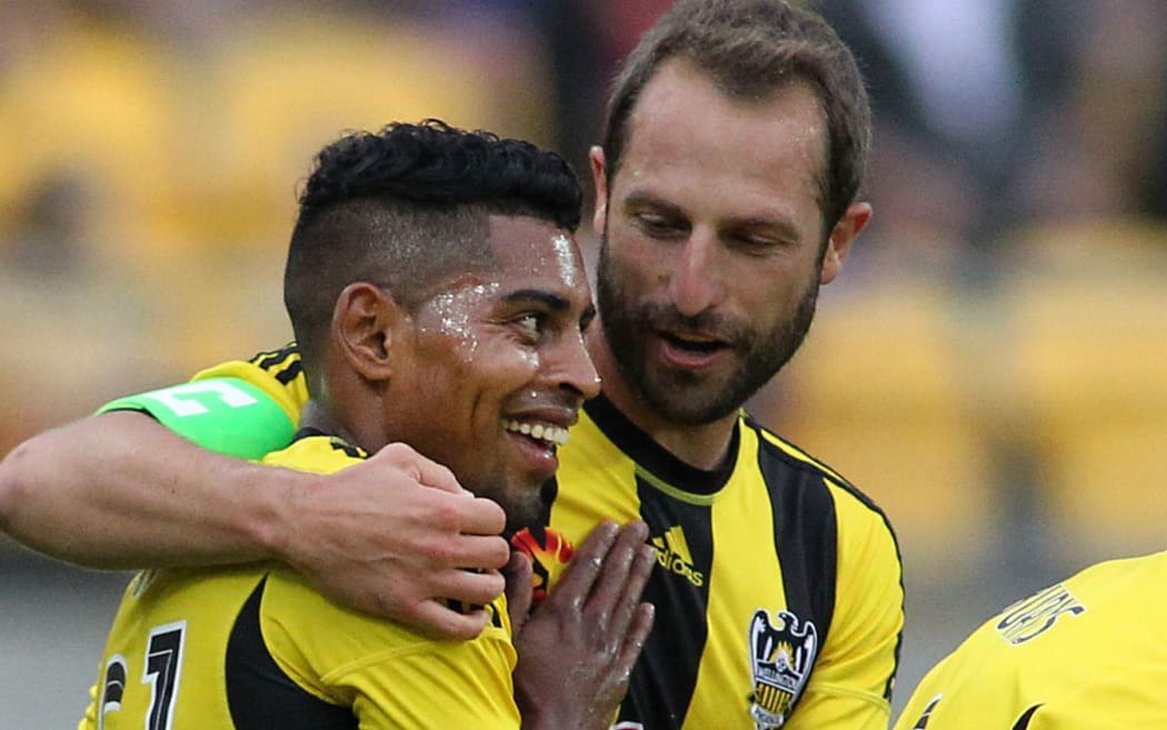 Andrew Durante hugs Roy Krishna after he scores a goal.