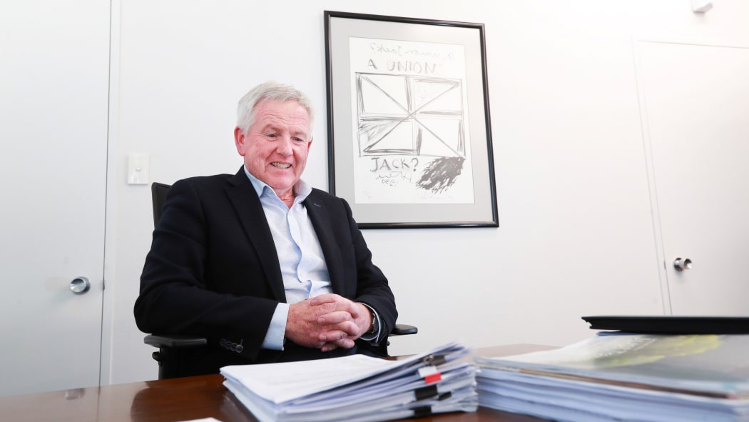 Marlborough Mayor John Leggett values art’s ability to start a conversation. Behind him is a Ralph Hotere print titled A Union Jack.