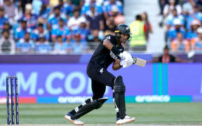 Rachin Ravindra of New Zealand plays a shot against India