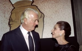 French designer Hubert de Givenchy and Audrey Hepburn talk together at the Galliera Museum in Paris during a reception honoring Givenchy for his 40 years in fashion.