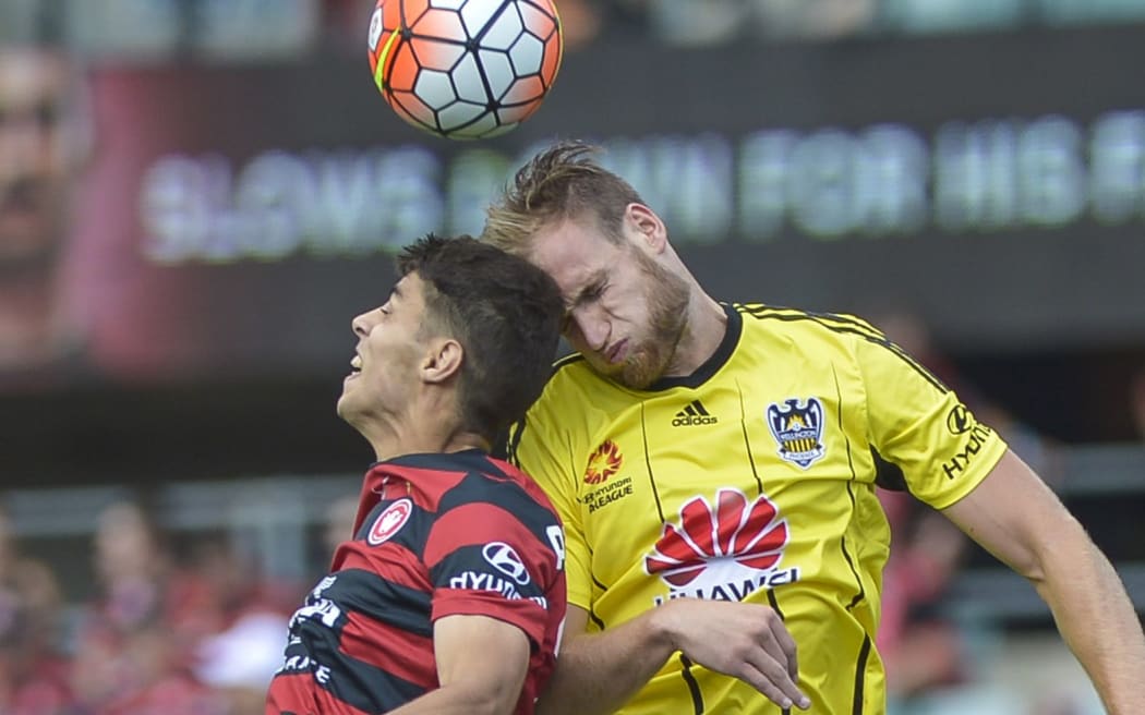 Hamish Watson (right) battles for a header against Western Sydney Wanderers.