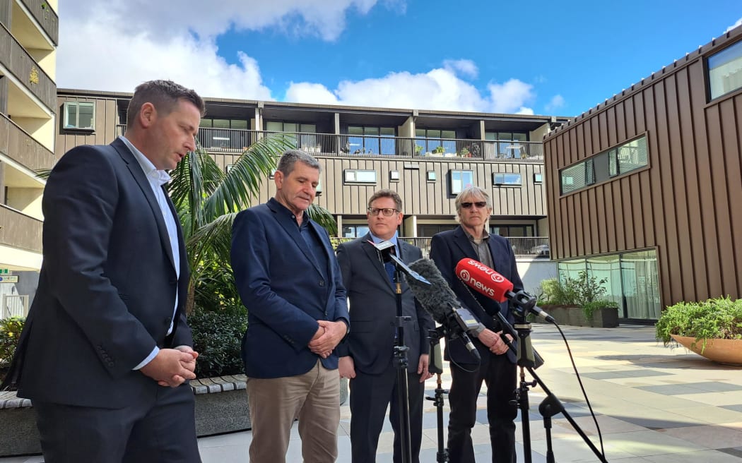 Alan Hall's two brothers, Geoff and Greg, accompanied by their two lawyers speak about the apology and compensation for their wrongly convicted brother.