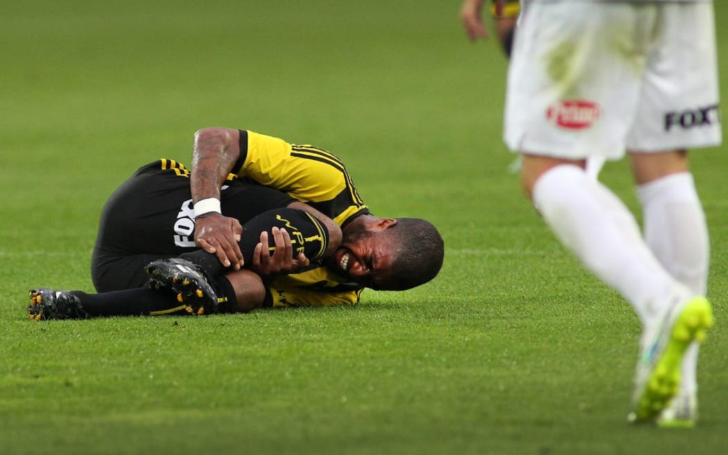 Phoenix star Roly Bonevacia is the most-fouled player in the A-League - here seen injured in the Western Sydney Wanderers match at Westpac Stadium, 28 December 2014. Photo.: Grant Down / www.photosport.co.nz