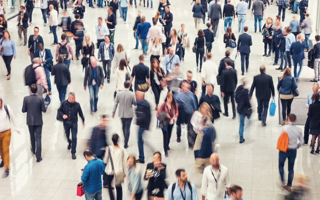 Crowd of people in a centre, expo, exhibition generic.