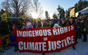 Climate activist Greta Thunberg marches beside members of the indigenous Sami community during a protest in Sweden.