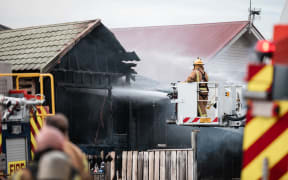 Firefighters tackling a blaze in a house on Yule Street, Kilbirnie, Wellington