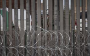 US Border Patrol agents patrol the Paso Del Norte International Bridge, where immigrants are crossing the Rio Grande between between Ciudad Juarez.