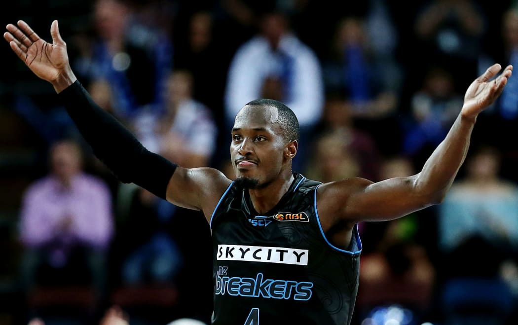 Cedric Jackson of the Breakers celebrates a three pointer.