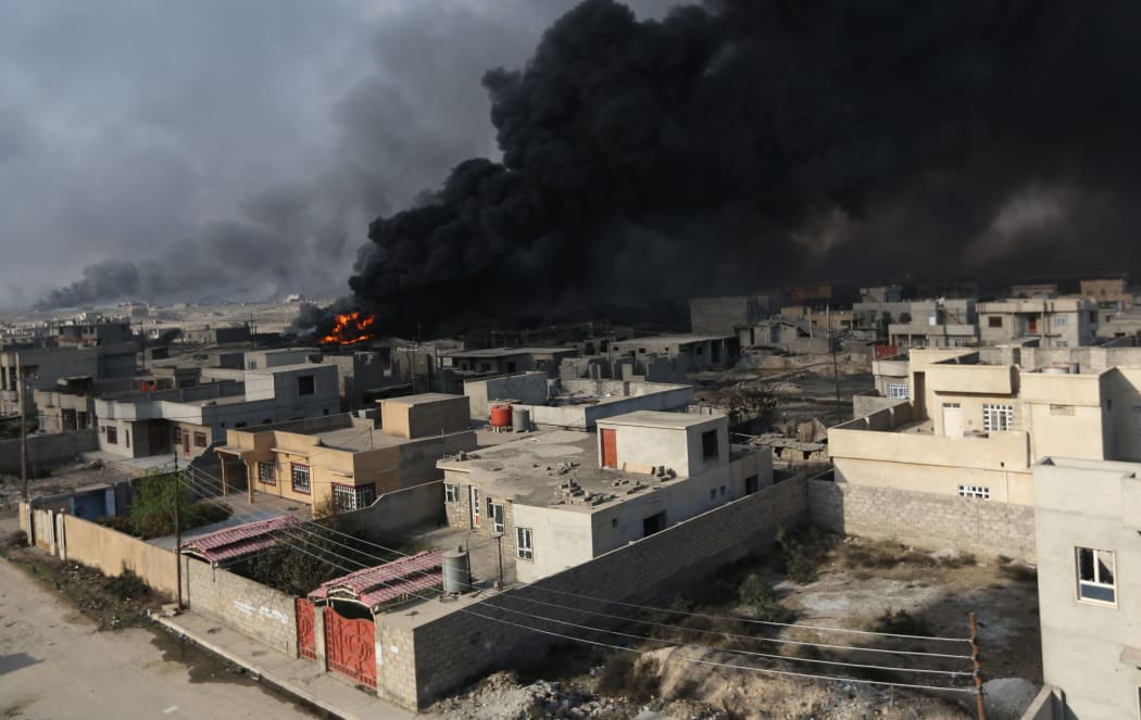 Smoke rises from oil wells, were set on fire by Daesh terrorists to limit coalition forces pilots' eyesight and to make the wells out of service following Iraqi army's retaking of Al Qayyarah town
