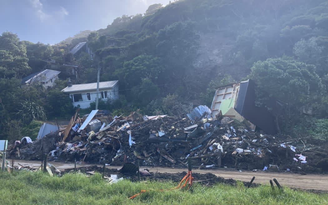 A photo taken on 22 February 2023 shows Karekare homes destroyed by a slip during Cyclone Gabrielle.