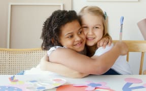 two children hugging