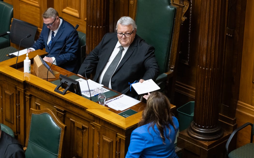 Nicola Willis hands the Speaker a copy of the 2024 Budget Statement.