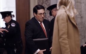 US President Donald Trump's personal attorney, Jay Sekulow (C) arrives at the US Capitol for President Donald Trump's impeachment trial in the Senate.