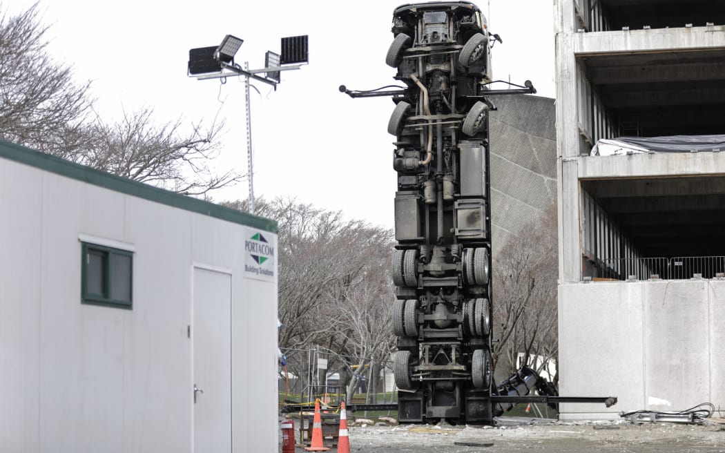 A truck has tipped up on its end outside the New Zealand Campus of Innovation and Sport in Upper Hutt.