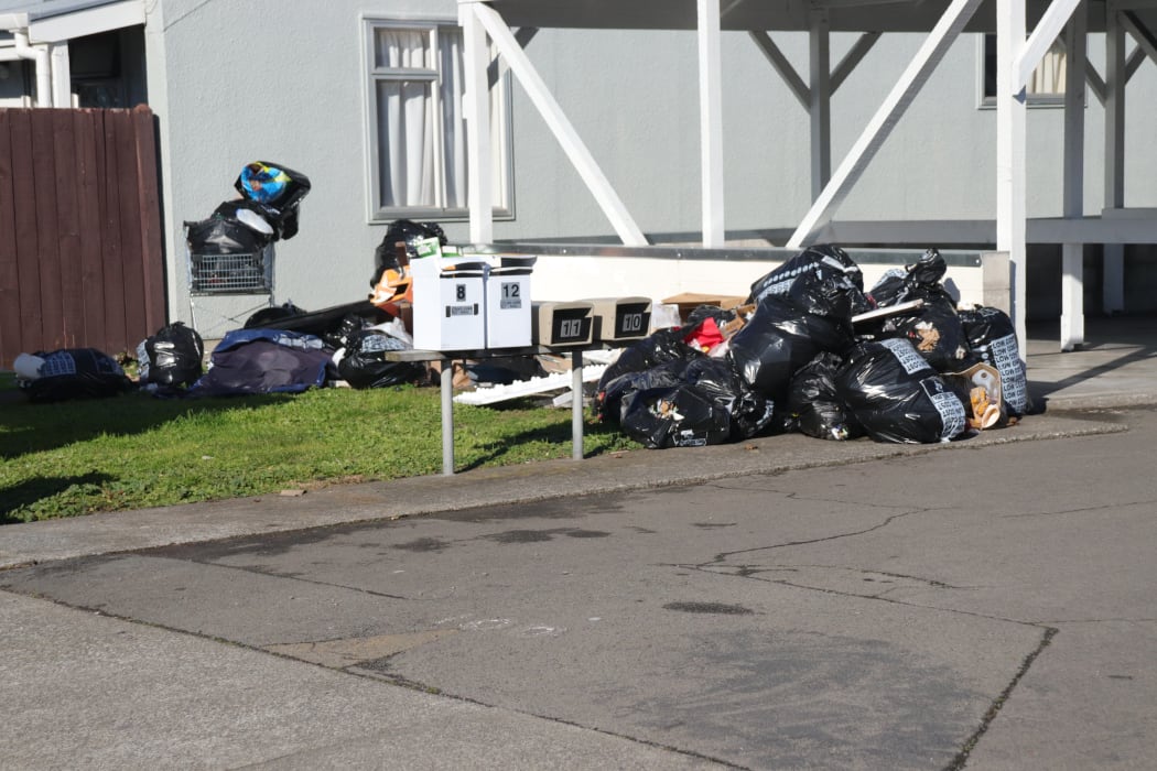 Rubbish strewn outside a Kāinga Ora flat complex in Napier.