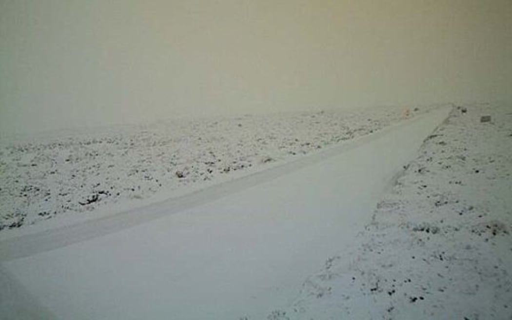 Desert road covered in snow