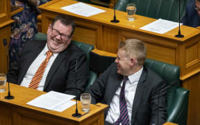 Chris Hipkins and Grant Robertson share a joke during the Address in Reply debate.