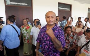 Talalelei Pauga and supporters outside court in Apia