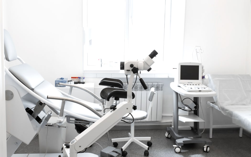 Gynecological chair, colposcope and ultrasound machine.