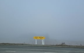 State Highway 8 sign between Omarama and Twizel, pictured 18 July, 2024, during foggy conditions.