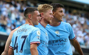 Manchester City players Phil Foden, Kevin de Bruyne and Rodri.