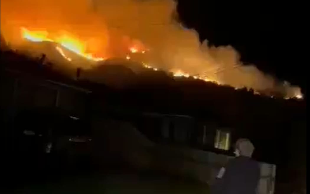 A large scrub fire is visible across the Port Hills in the area of Alderson Avenue off the Port Hills Road, close to the suburb of Hillsborough.