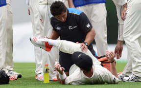 Tim Southee gets treatment from the Black Caps physio during the first test at the Gabba in Brisbane.