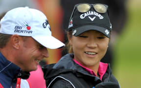 The New Zealand golfer Lydia Ko shares a joke with her caddy at the British Open.