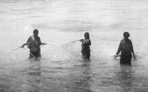 Chuuk women fishing with hand nets, 1899 -1900.