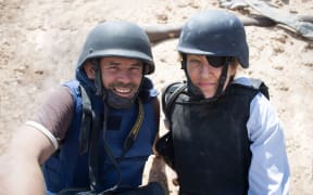 Paul Conroy and Marie Colvin in the field