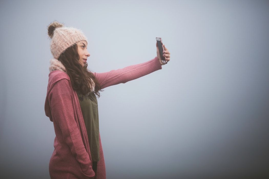 Woman taking a selfie. generic image