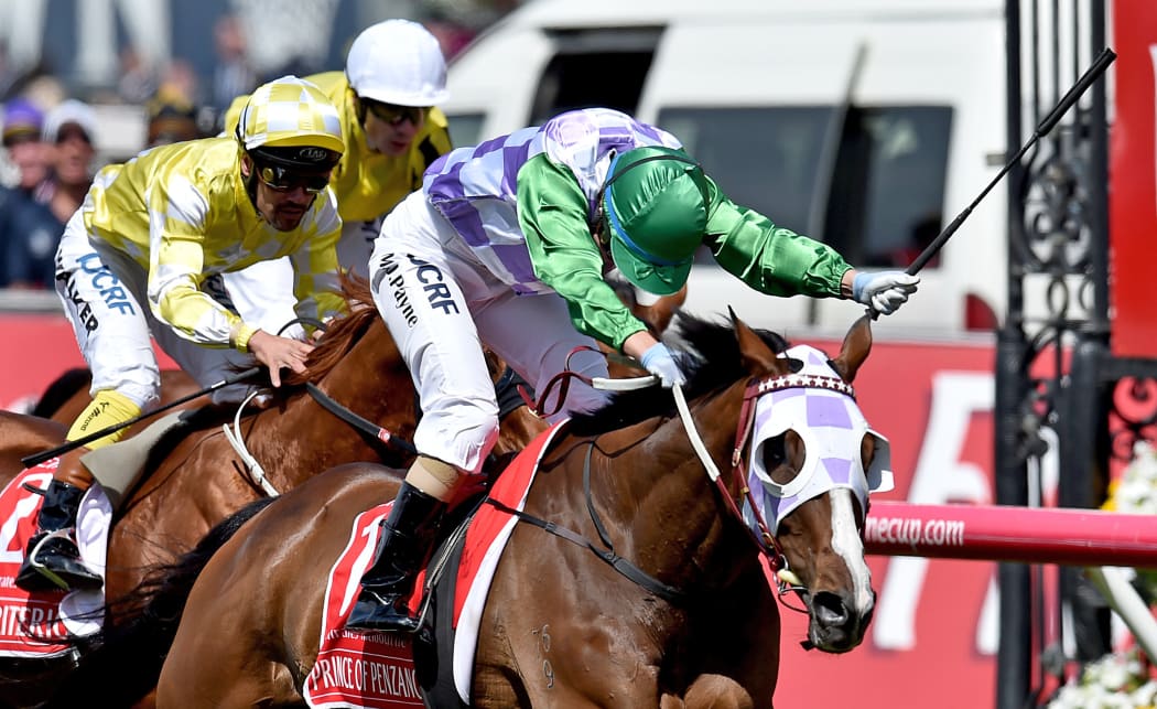 Jockey Michelle Payne riding Prince Of Penzance crosses the finish line to win the Melbourne Cup race at Flemington Racecourse in Melbourne, on Tuesday, Nov. 3, 2015.