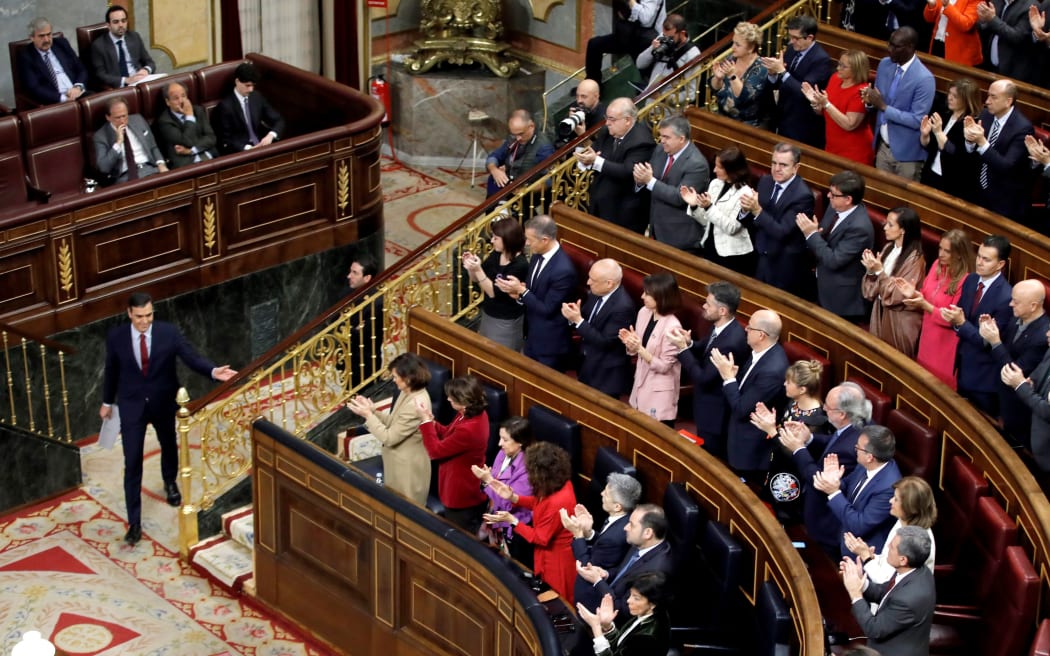Pedro Sanchez delivers a speech as he is confirmed as prime minister for another term at the helm of the country's first-ever coalition government since its return to democracy in the 1970s.