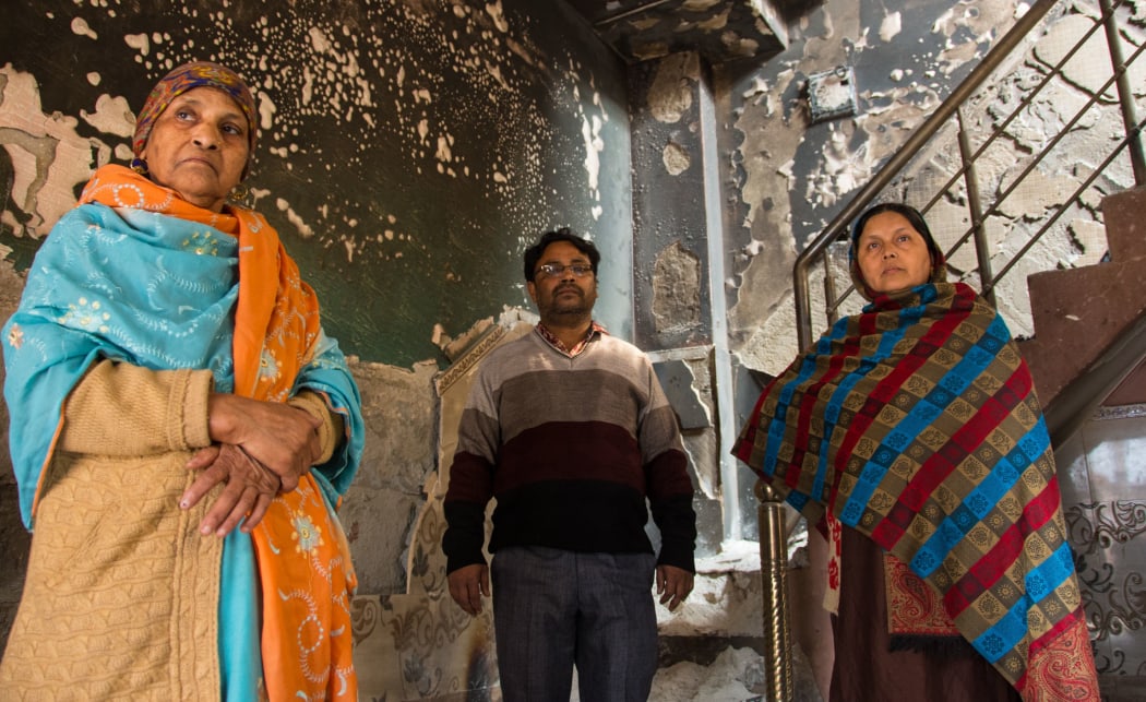 DELHI, INDIA - MARCH 07: Mohammad Arif along with his mother and wife returned back to his factory which was set ablaze by the rioters in Shiv Vihar which become the haunted colony for muslims, the worst affected locality of Delhi riots,