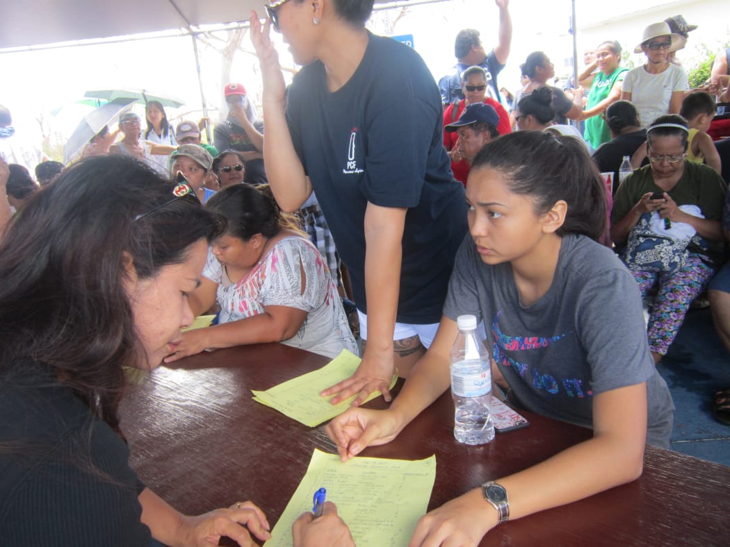 Saipan residents queue for post-typhoon aid at the American Memorial Park, Northern Marianas.