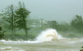 Waves crash into a breakwall after Tropical Cyclone Marcia made landfall in the coastal town of Yeppoon.