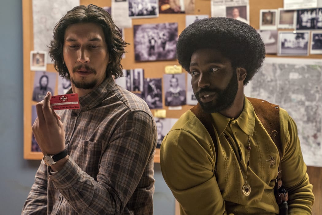 This image released by Focus Features shows Adam Driver, left, and John David Washington in a scene from "BlacKkKlansman."