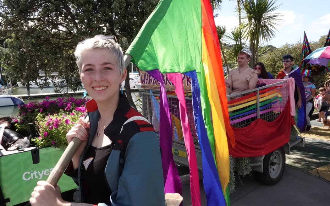 Whangārei’s Annalisa Gabler carries a rainbow flag through the Town Basin.