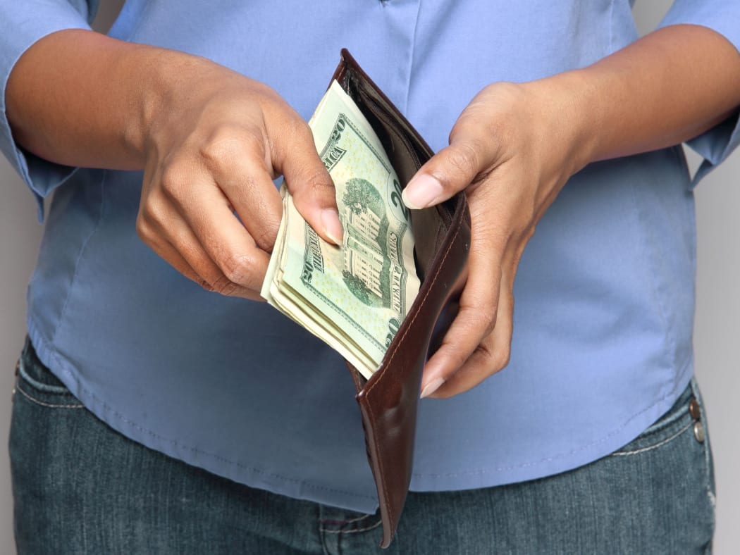 Person holding wallet