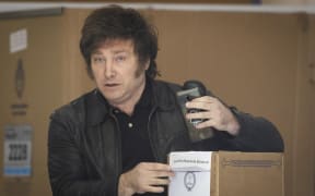 Argentine presidential candidate Javier Milei of La Libertad Avanza party votes during Argentina's runoff presidential election, in Buenos Aires, Argentina November 19, 2023.