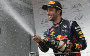 The Australian Formula One driver, Daniel Ricciardo, celebrates a win.